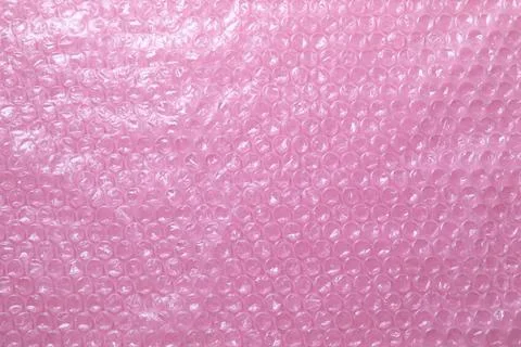 Transparent bubble wrap on pink background, top view Foto stock