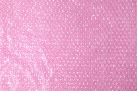 Transparent bubble wrap on pink background, top view Stock Photos