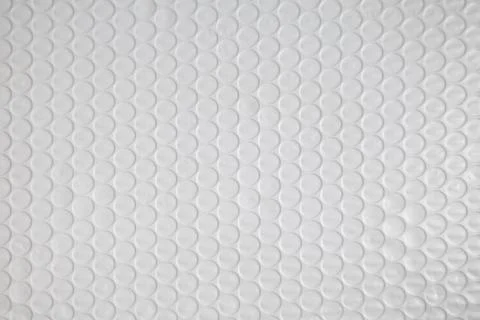 Transparent bubble wrap texture for packaging, cushioning, shipping, protection Stock Photos