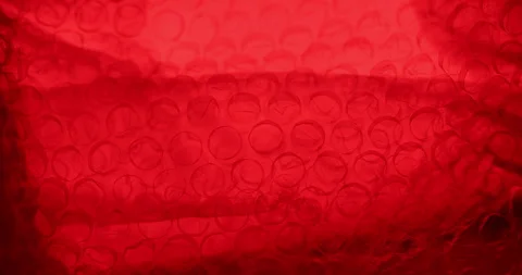 Transparent Bubble Wrap Texture Red light Stock Footage 313261918