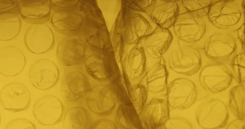 Transparent Bubble Wrap Texture Yellow light Stock Footage 313263855