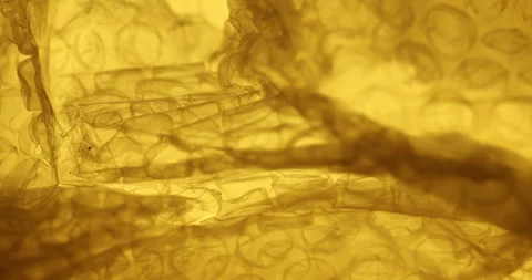 Transparent Bubble Wrap Texture Yellow light Stock Footage 313263913