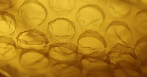 Transparent Bubble Wrap Texture Yellow light Stock Footage 313265241