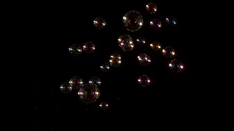 Transparent bubbles against dark backdrop Video stock 77134565