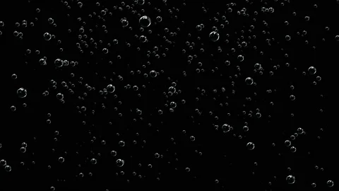 Transparent bubbles of different sizes on a dark background rise up. Rising Stock Footage 118981334