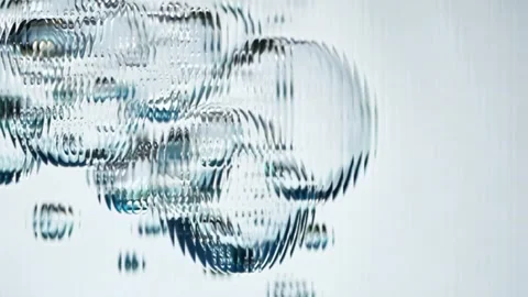 Transparent bubbles floating on white background Stock Footage 306581602