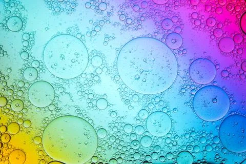Transparent bubbles on rainbow background Stock-Fotos