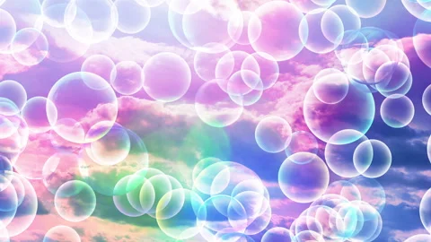 Transparent bubbles rise up and increase in size against a colorful rainbow sky. Видео 262552359