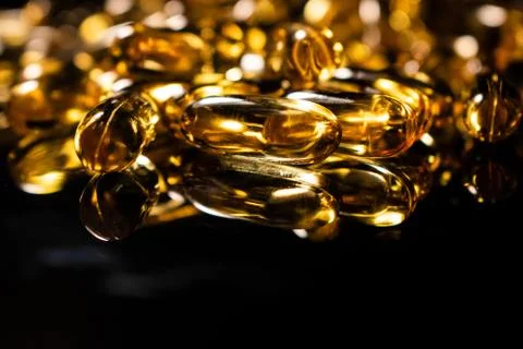 Transparent capsules on black background Stock Photos