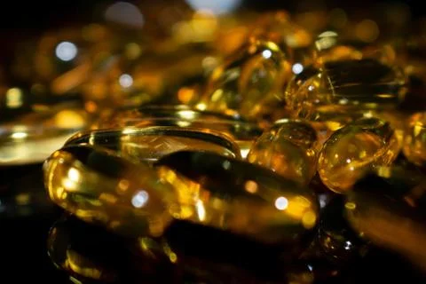 Transparent capsules on a dark background Stock Photos