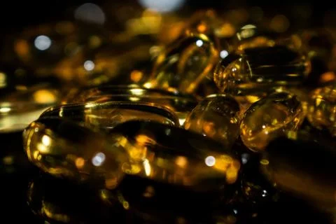 Transparent capsules on a dark background Stock Photos