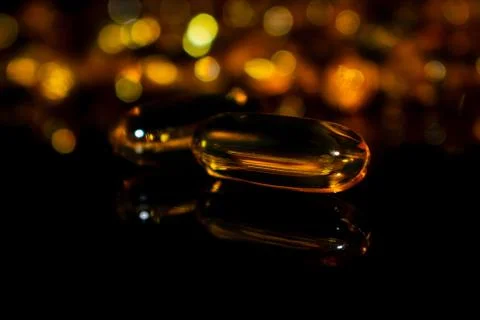 Transparent capsules on a dark background Stock Photos