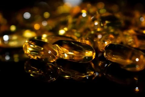 Transparent capsules on a dark background Stock Photos