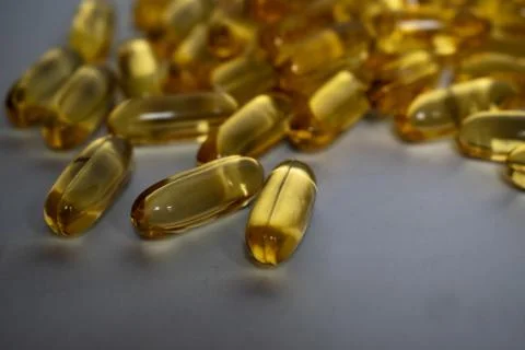 Transparent capsules on gray background Stock Photos