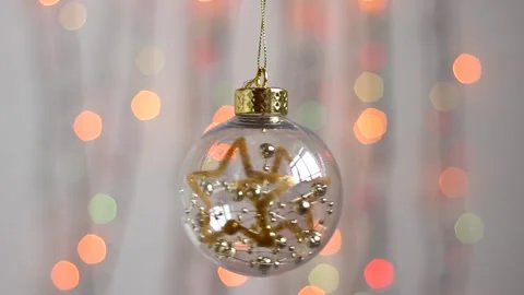 Transparent Christmas tree toy in the form of a sphere. Stock Footage 143379077