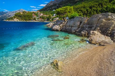 Transparent clean sea and gravelly beach in Brela, Dalmatia, Croatia Stock Photos