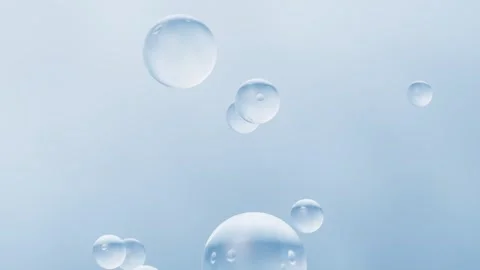 Transparent clear water bubbles floating and moving in slow motion on a lig.. 스톡 동영상 327524332