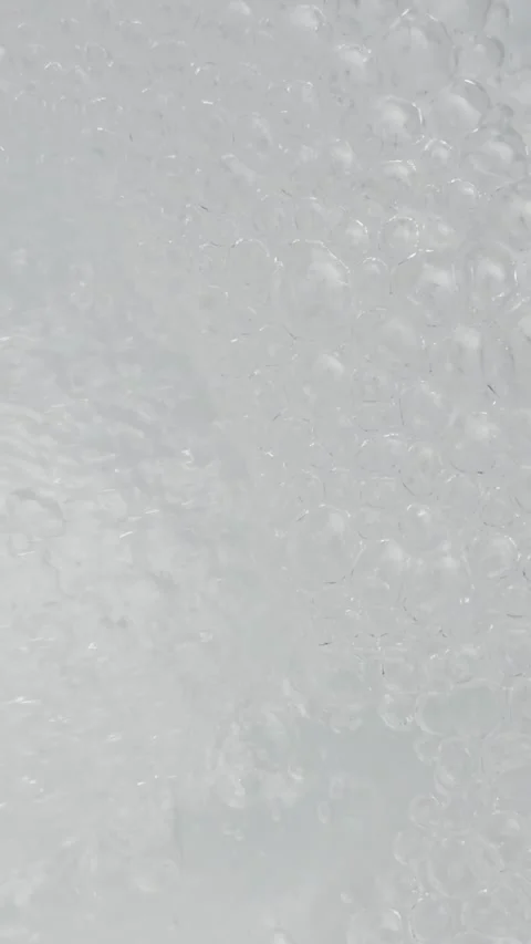 Transparent clear water surface texture background with splashes and many bubble Stock Footage 339020258