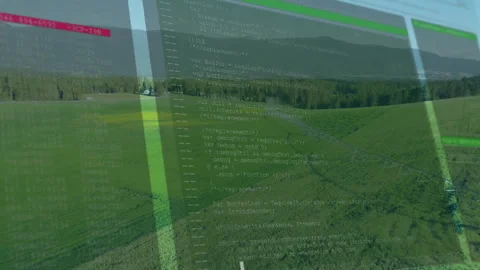 Transparent code editor window floating over fields showing red green syntax Stock Footage 307431836