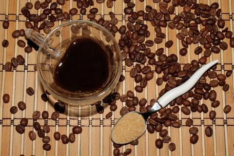 Transparent coffee mug on the background of beans and mats Stock Photos