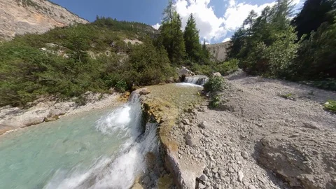 Transparent cold alpine creek with small lake and waterfalls Stock Footage 114075885