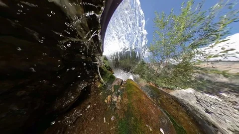 Transparent cold alpine creek with waterfall, under the waterfall effect Stock Footage 114075865