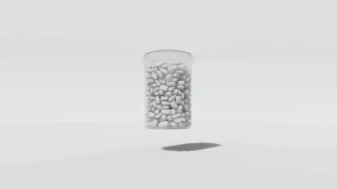 Transparent Container Full of White Capsules or Pellets Stock Footage 320322024