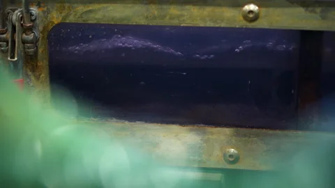 Transparent container with glass window holds bubbling water Stock Footage 304384722