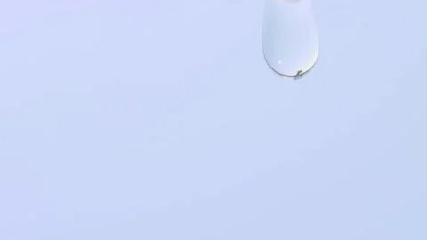 Transparent cosmetic liquid texture dripping macro. Liquid collagen Stock Footage 231768561