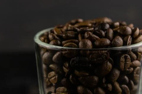 Transparent Cup with coffee beans Stock Photos