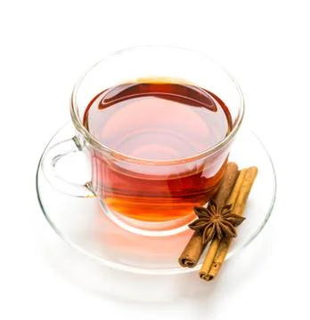 Transparent cup of tea and cinnamon steaks on white Stock Photos