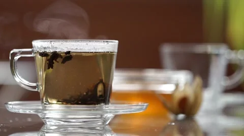 Transparent cup of tea on the table Stock Footage 60235275
