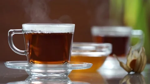 Transparent cup of tea on the table Video stock 60250070