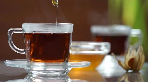 Transparent cup of tea on the table Stock Footage 60253746