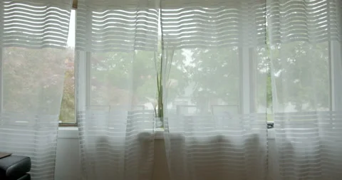 The transparent curtain blows in the summer wind Stock Footage 131928495