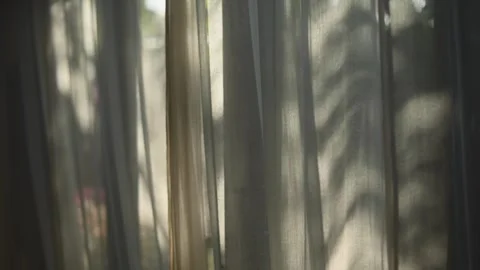 Transparent curtain on the window, gently moved by the wind. Stock Footage 246488458