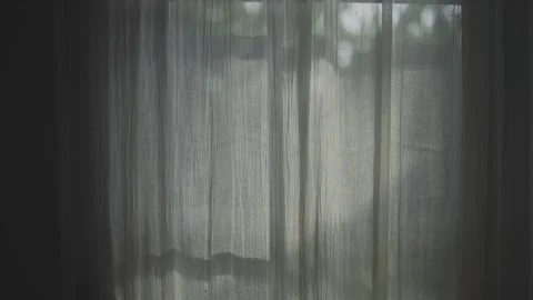 Transparent curtain on the window, gently moved by the wind. Stock Footage 246781383