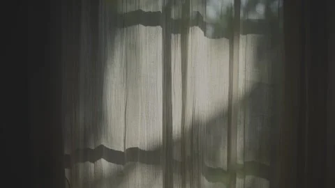 Transparent curtain on the window, gently moved by the wind. Stock Footage 247961862