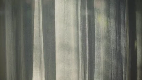 Transparent curtain on the window, gently moved by the wind. Stock Footage 248243609