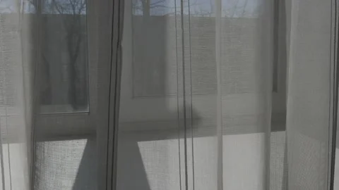 Transparent curtains with stripes on the window Stock Footage 182423836