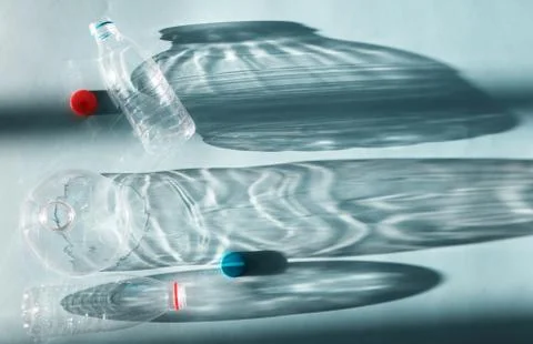 Transparent empty plastic bottle for ecological recycled backlit by bright su Stock Photos