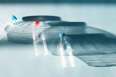 Transparent empty plastic bottle for ecological recycled backlit by bright su Stock Photos