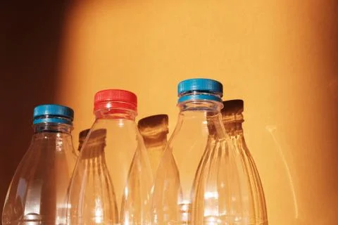 Transparent empty plastic bottle for ecological recycled backlit by bright su Stock Photos