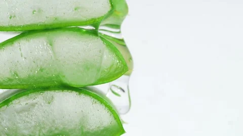 Transparent Extract Gel Flows Through Aloe Vera Slices Stacked Pieces Of Leaves Video stock 262978784