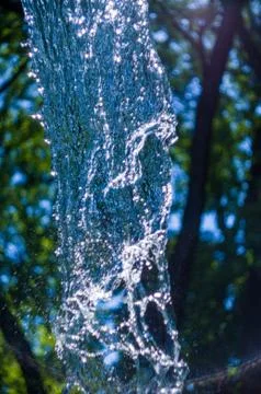 Transparent falling water vertical flows, close up Stock Photos