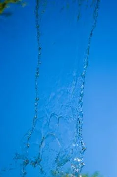Transparent falling water vertical flows, close up Stock Photos