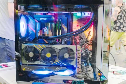 Transparent gaming PC on display at tech event, illuminated with multi-colo.. Stock Photos
