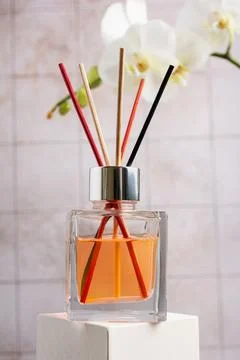 Transparent glass bottle of reed diffuser, air freshener for aromatherapy, re Stock Photos
