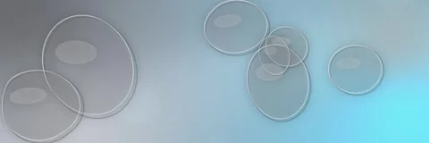 Transparent glass bubbles floating over a silver gray and cyan gradient, website Stock Footage 340156397