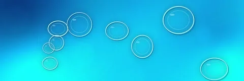 Transparent glass bubbles floating over an electric blue, cyan and turquoise Stock Footage 340156624